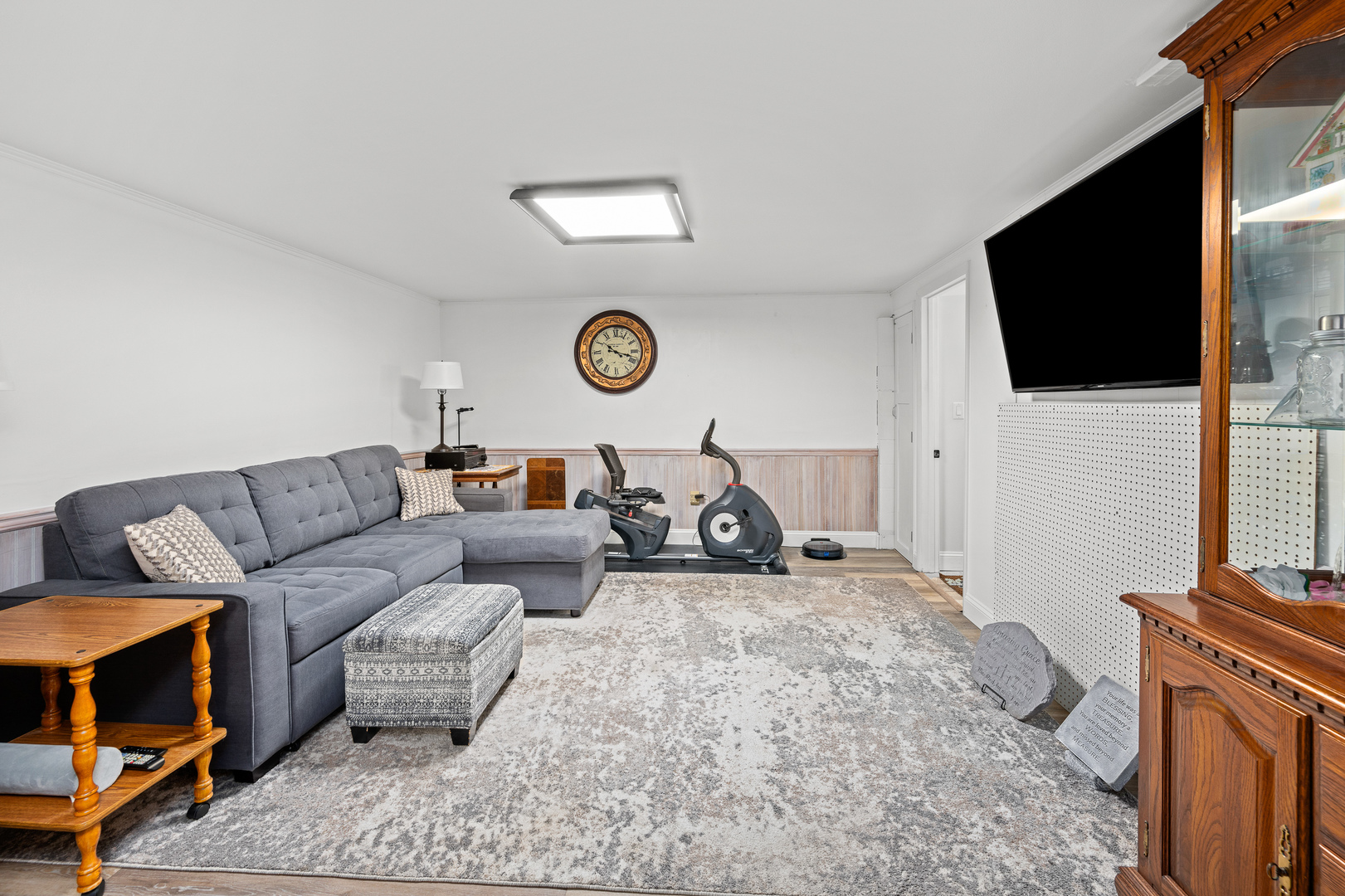 506 Bush Street Reynolds, IL 61279 - Photo 23 of 37 a living room with furniture a flat screen tv and a fireplace