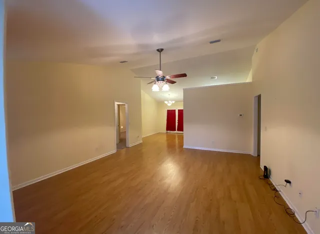 a view of a livingroom with a chandelier fan