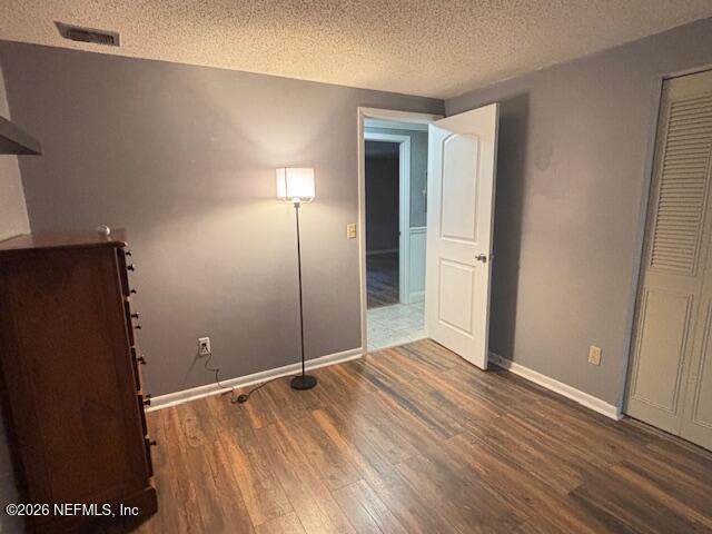 6626 Arrowroot Drive Jacksonville, FL 32244 - Photo 15 of 23 an empty room with wooden floor and closet