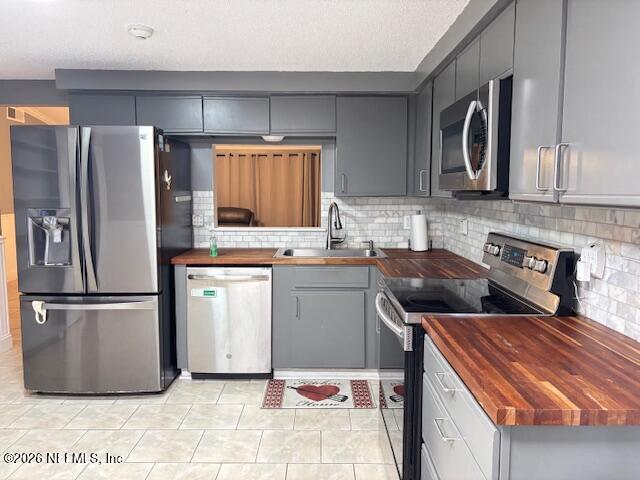 6626 Arrowroot Drive Jacksonville, FL 32244 - Photo 6 of 23 a kitchen with a refrigerator and a sink