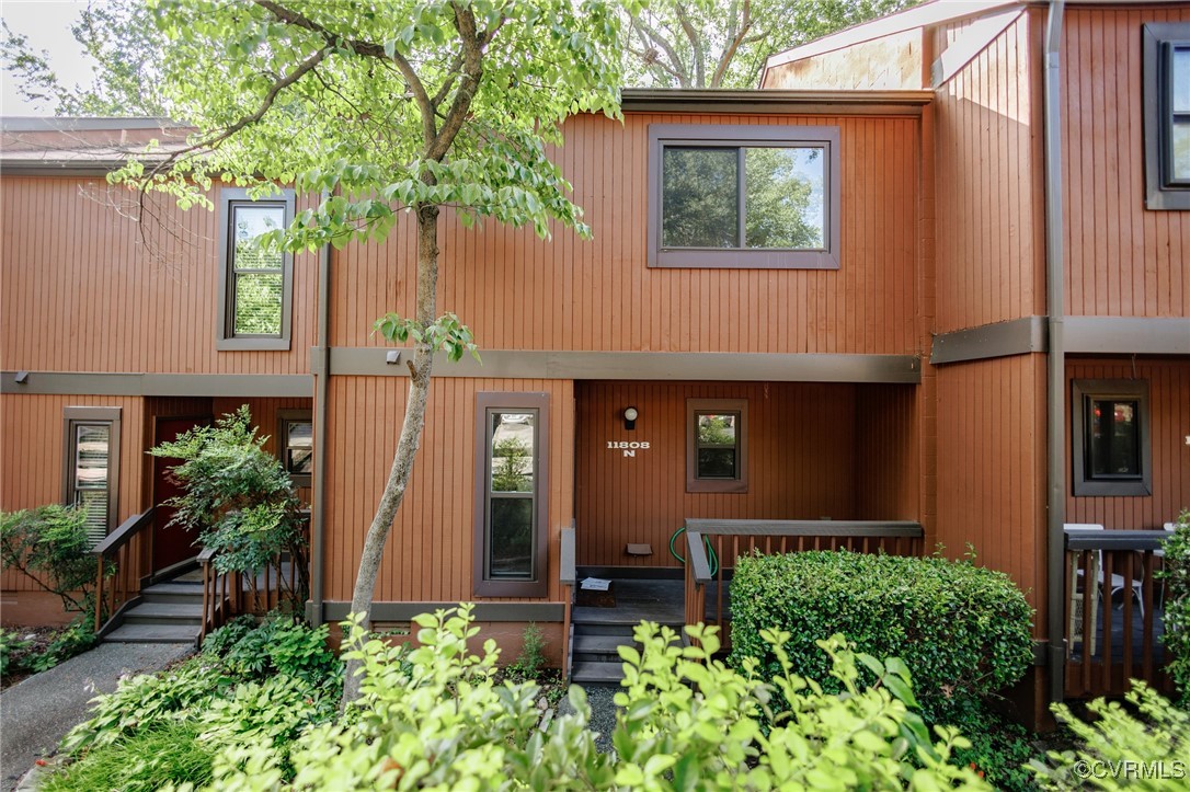 11808 North Briar Patch Drive Midlothian, VA 23113 - Photo 1 of 42 a front view of a house with garden
