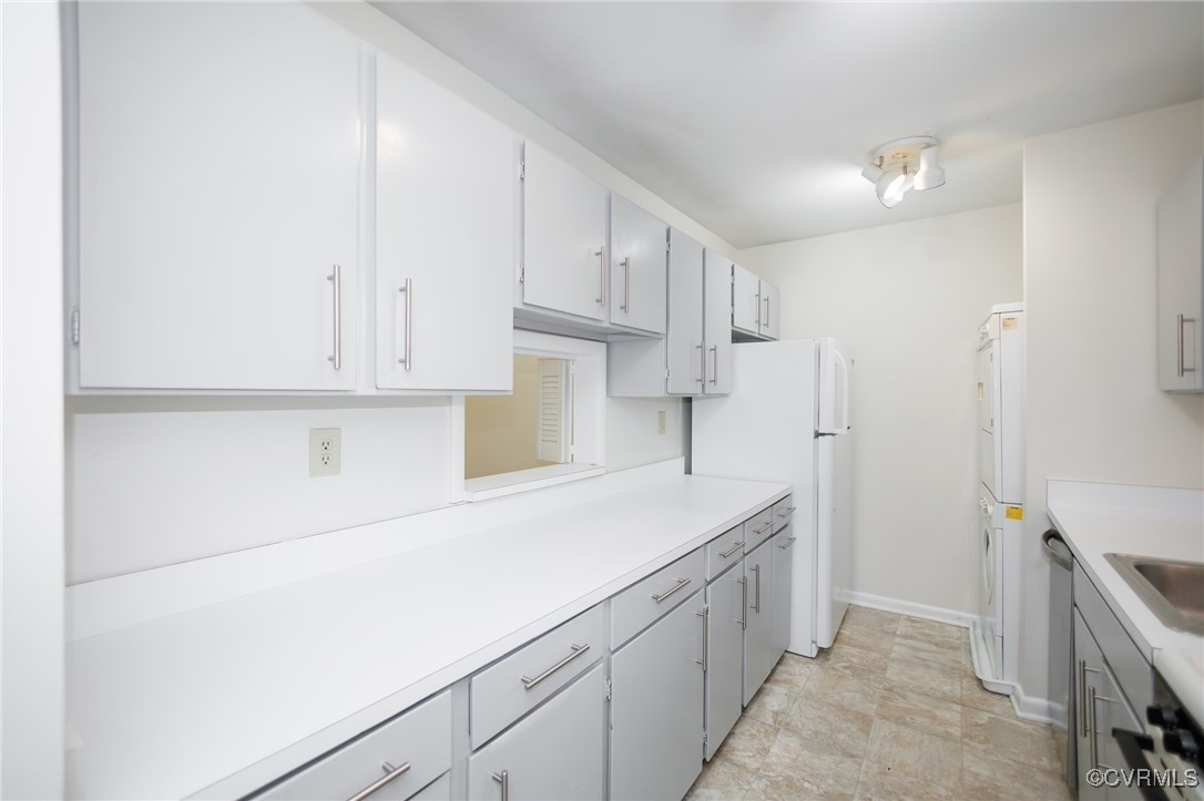 11808 North Briar Patch Drive Midlothian, VA 23113 - Photo 11 of 42 a kitchen with cabinets and a refrigerator