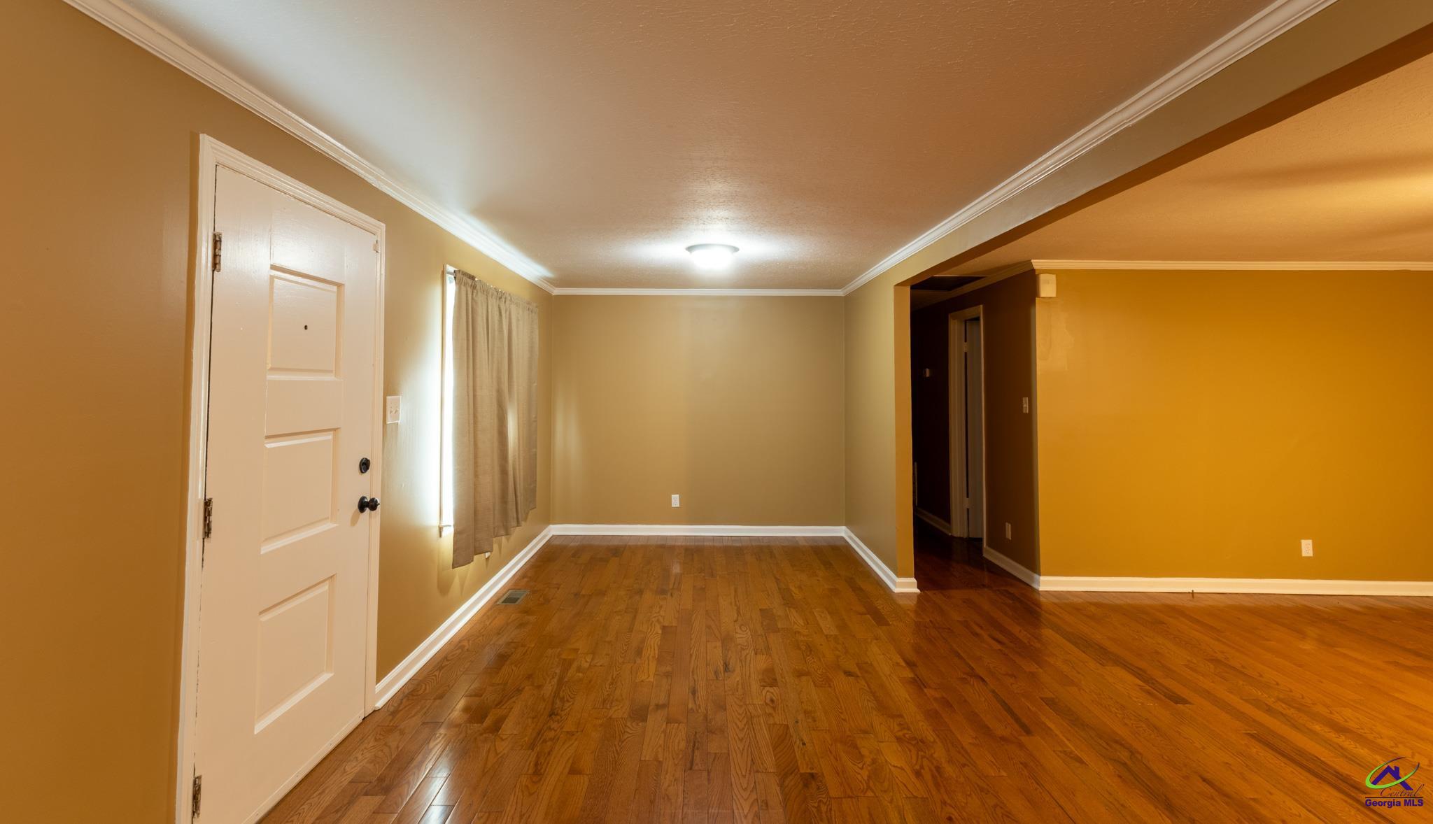 3491 Sandy Circle Macon, GA 31216 - Photo 3 of 47 a view of a hallway with wooden floor