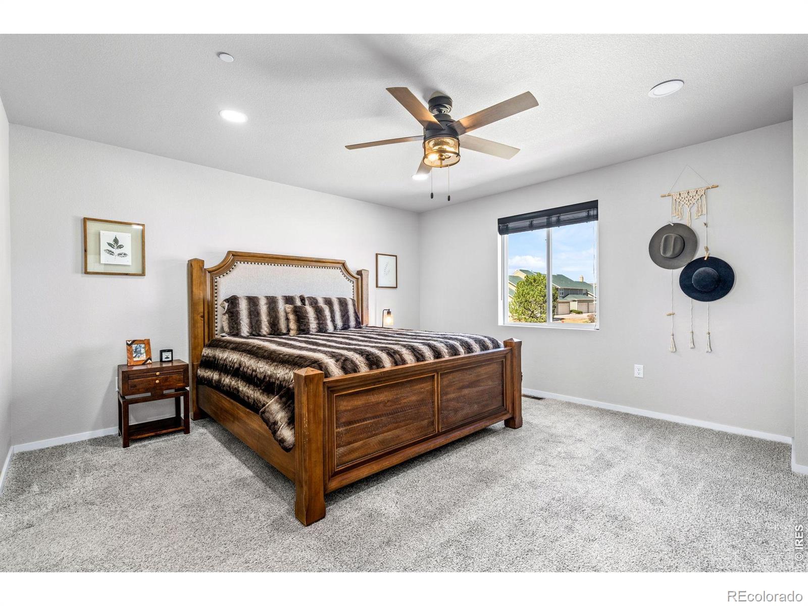6609 West 4th Street Road Greeley, CO 80634 - Photo 11 of 23 a bedroom with a bed and window
