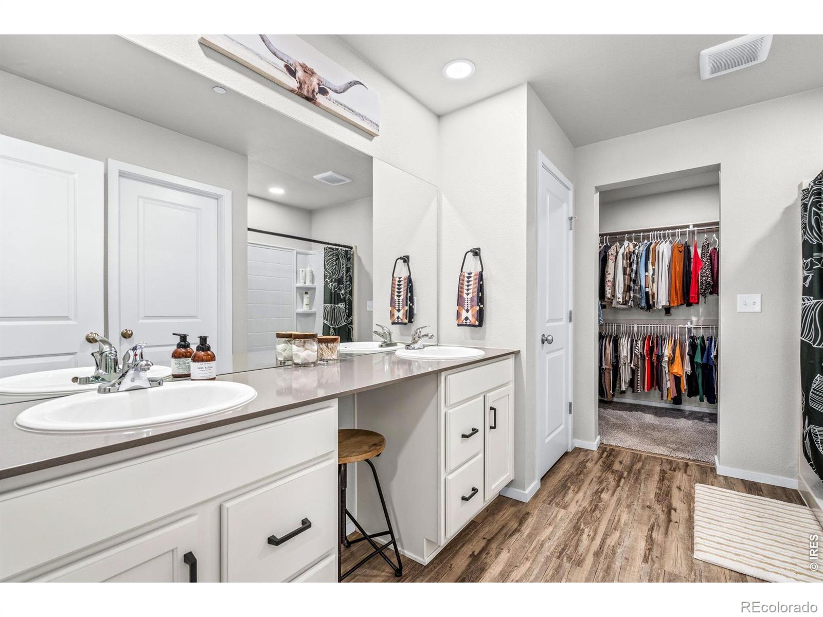 6609 West 4th Street Road Greeley, CO 80634 - Photo 14 of 23 a spacious bathroom with a sink double vanity and a mirror