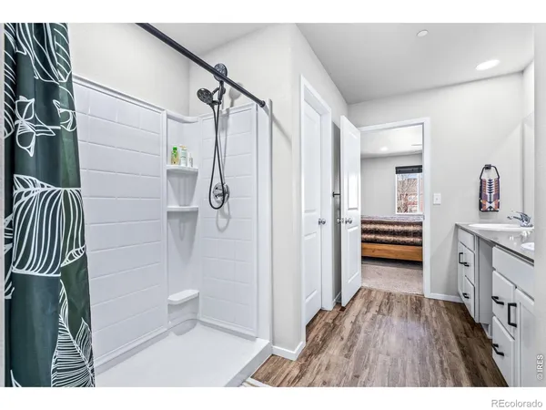 a bathroom with a double vanity sink and mirror