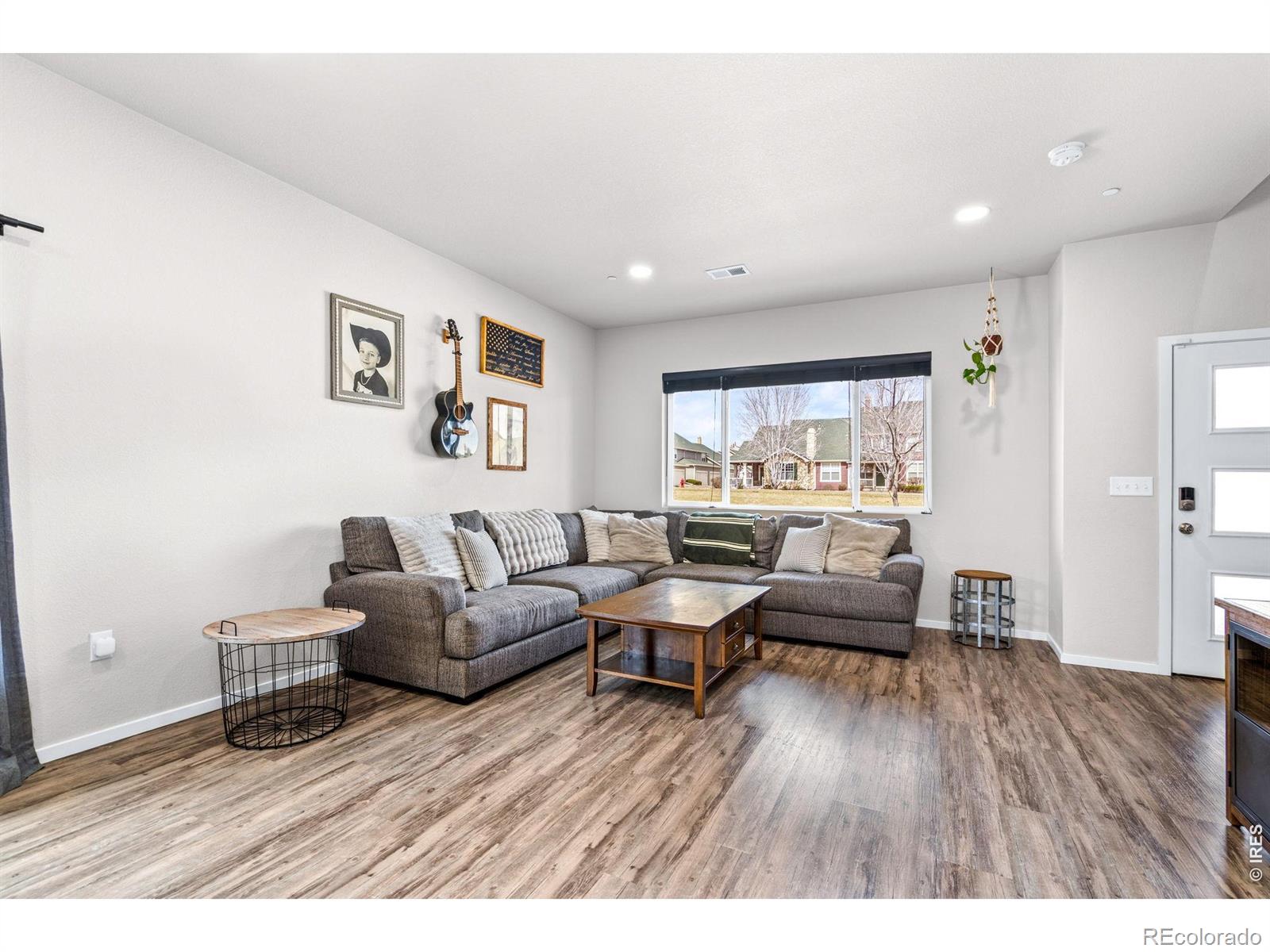 6609 West 4th Street Road Greeley, CO 80634 - Photo 4 of 23 a living room with furniture and a wooden floor
