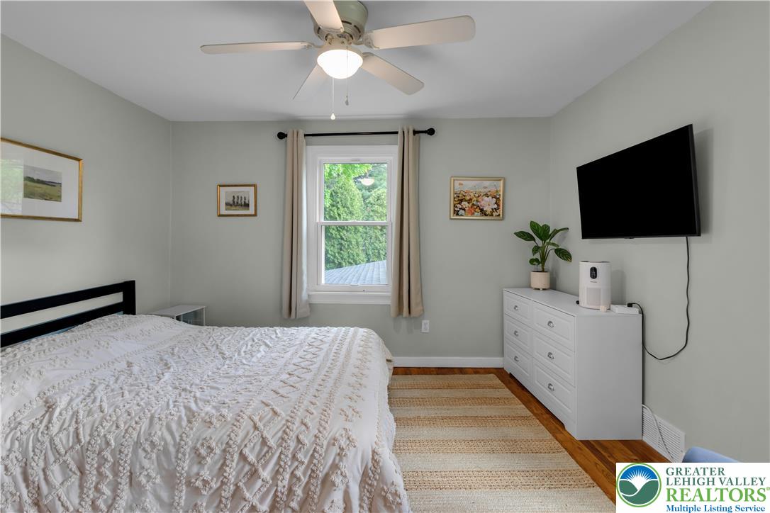 2242 Church Road Bethlehem, PA 18015 - Photo 28 of 74 a bedroom with a bed and a flat screen tv