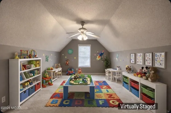 a living room with lots of furniture and book shelf
