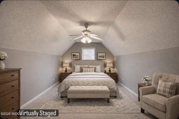 a bed room with a bed and a couch