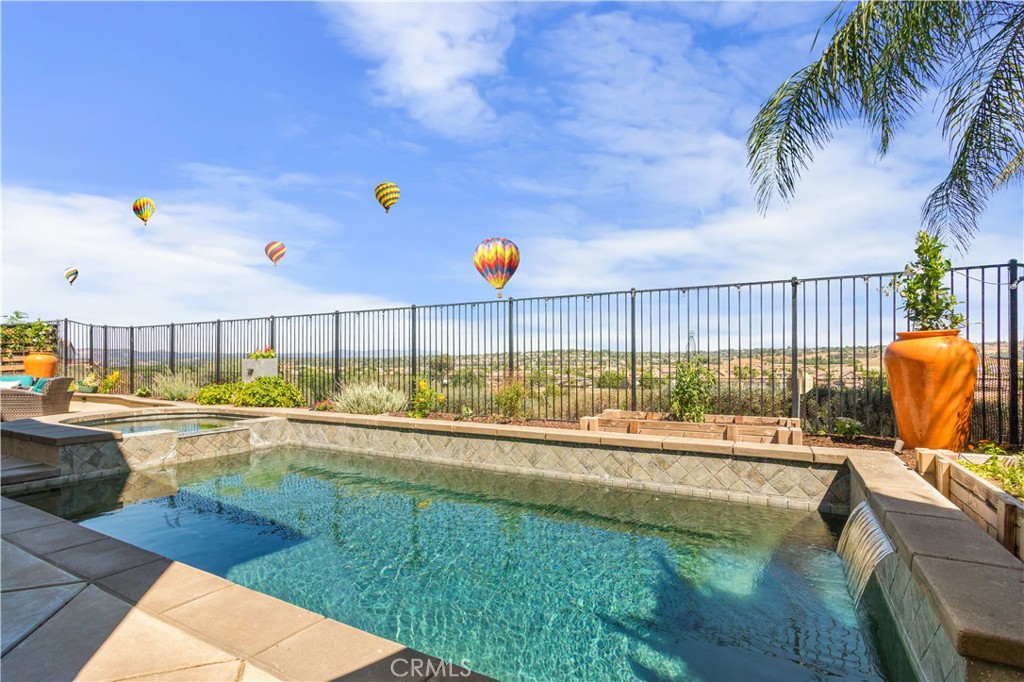 a view of a swimming pool with a lounge chairs