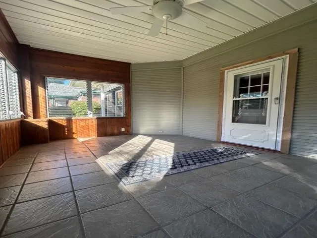 a view of an empty room with a fireplace
