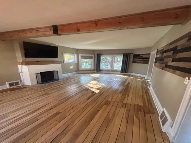 a kitchen with stainless steel appliances a stove refrigerator and cabinets