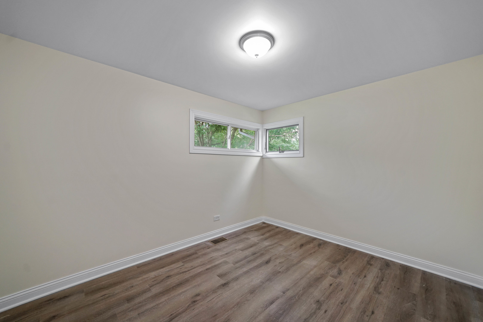 1441 Burr Oak Road Homewood, IL 60430 - Photo 14 of 27 a view of an empty room with wooden floor and a window