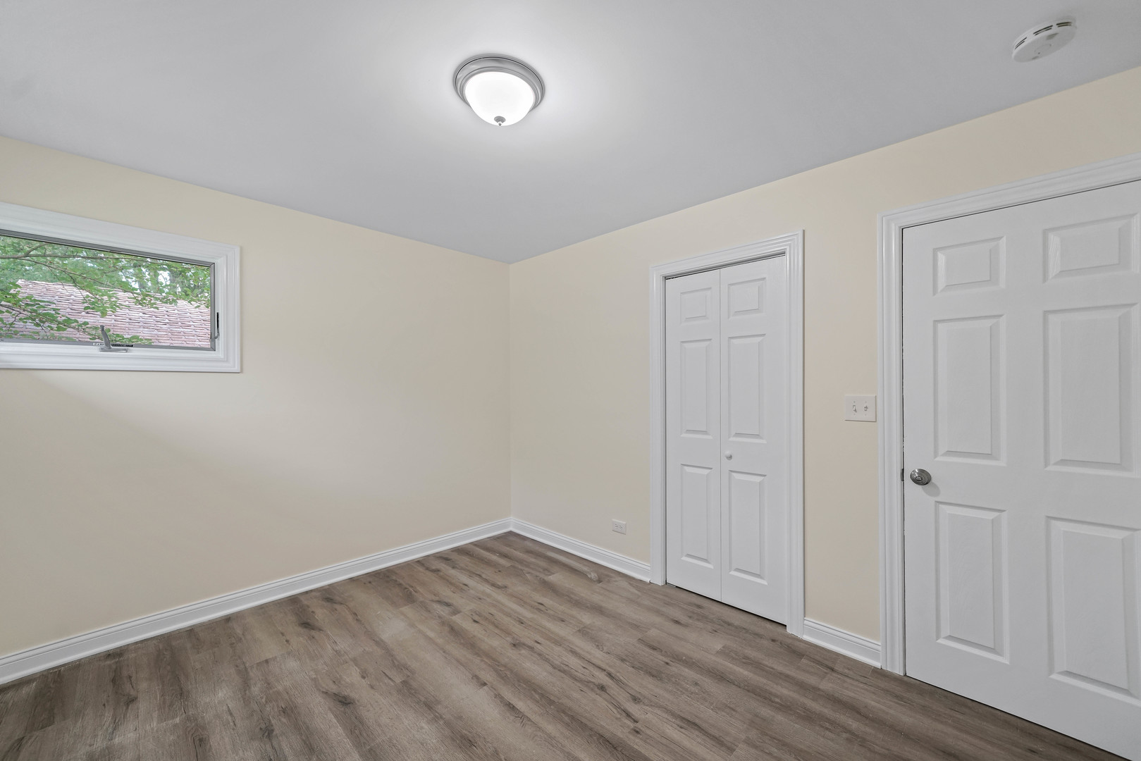 1441 Burr Oak Road Homewood, IL 60430 - Photo 15 of 27 an empty room with wooden floor and windows