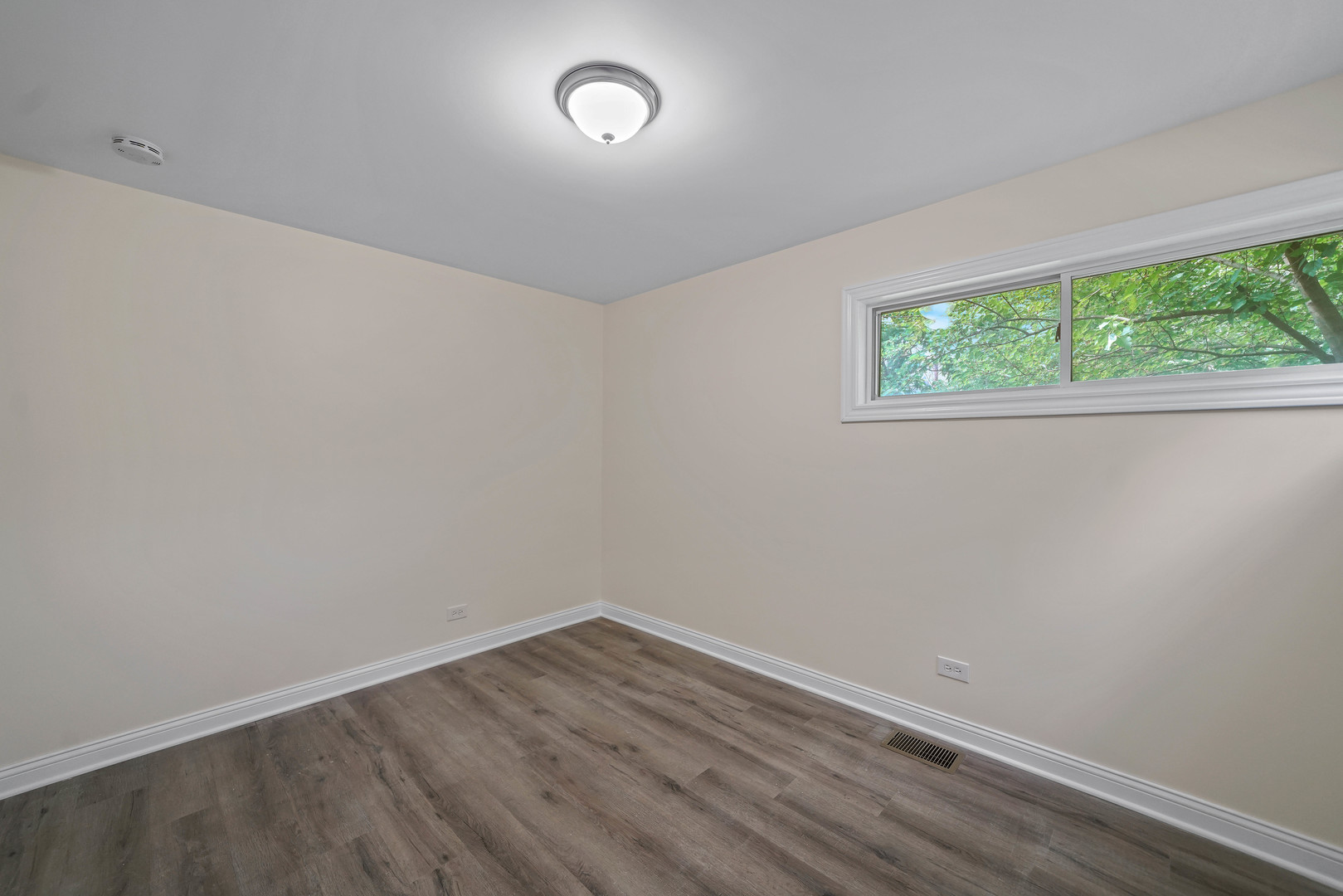 1441 Burr Oak Road Homewood, IL 60430 - Photo 17 of 27 an empty room with wooden floor and windows