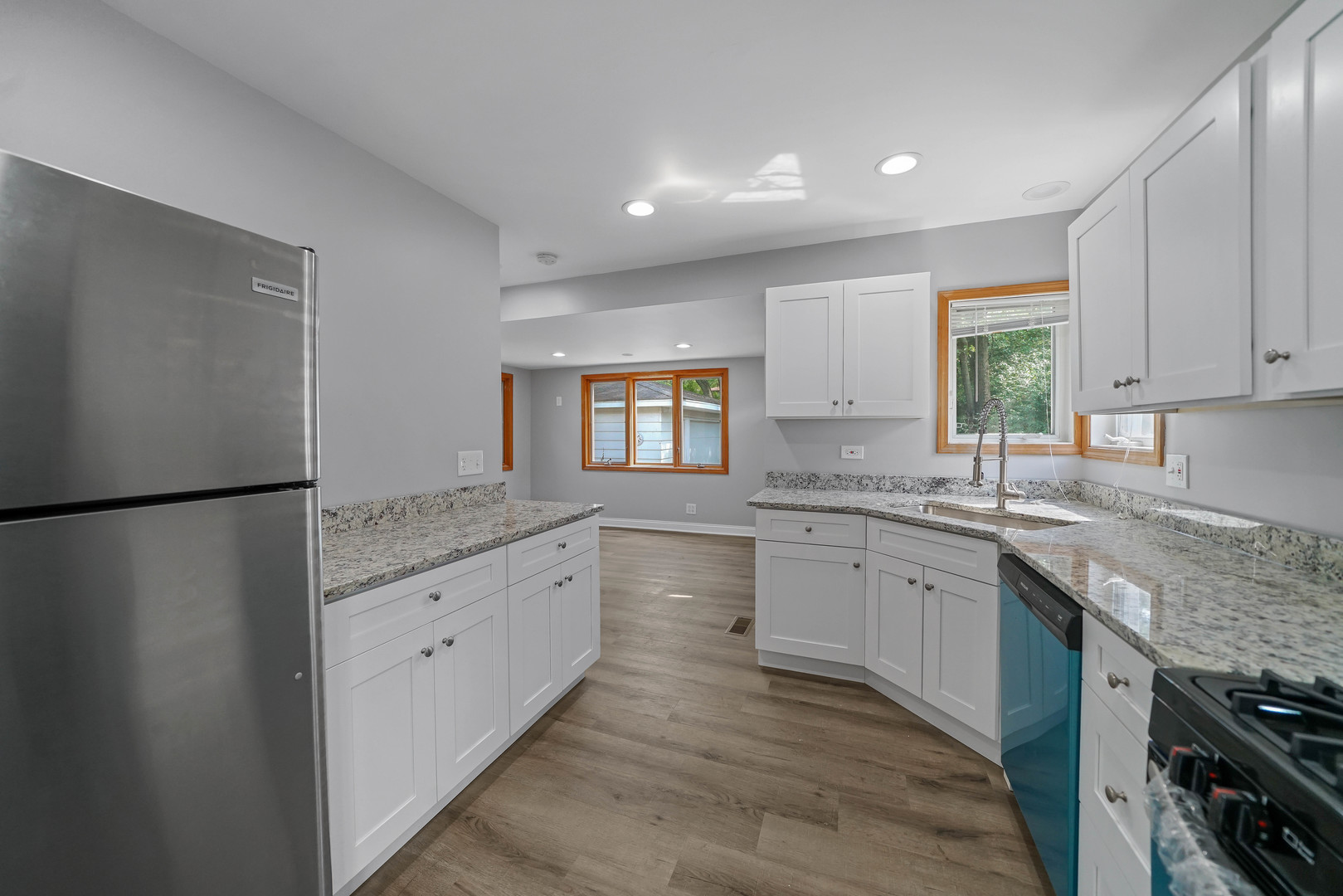 1441 Burr Oak Road Homewood, IL 60430 - Photo 3 of 27 a kitchen with granite countertop white cabinets a refrigerator and a sink