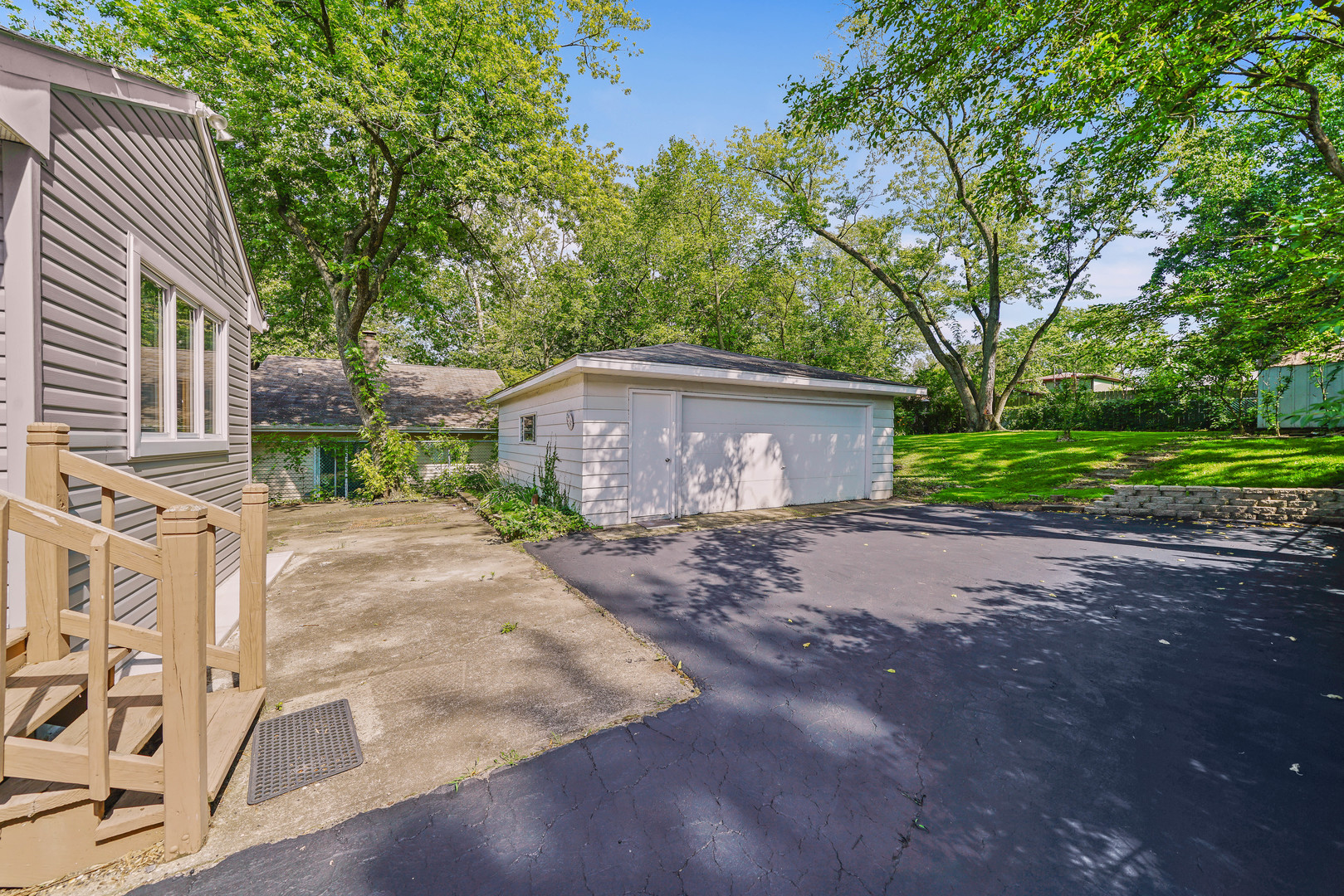 1441 Burr Oak Road Homewood, IL 60430 - Photo 22 of 27 a view of a house with a yard and large tree
