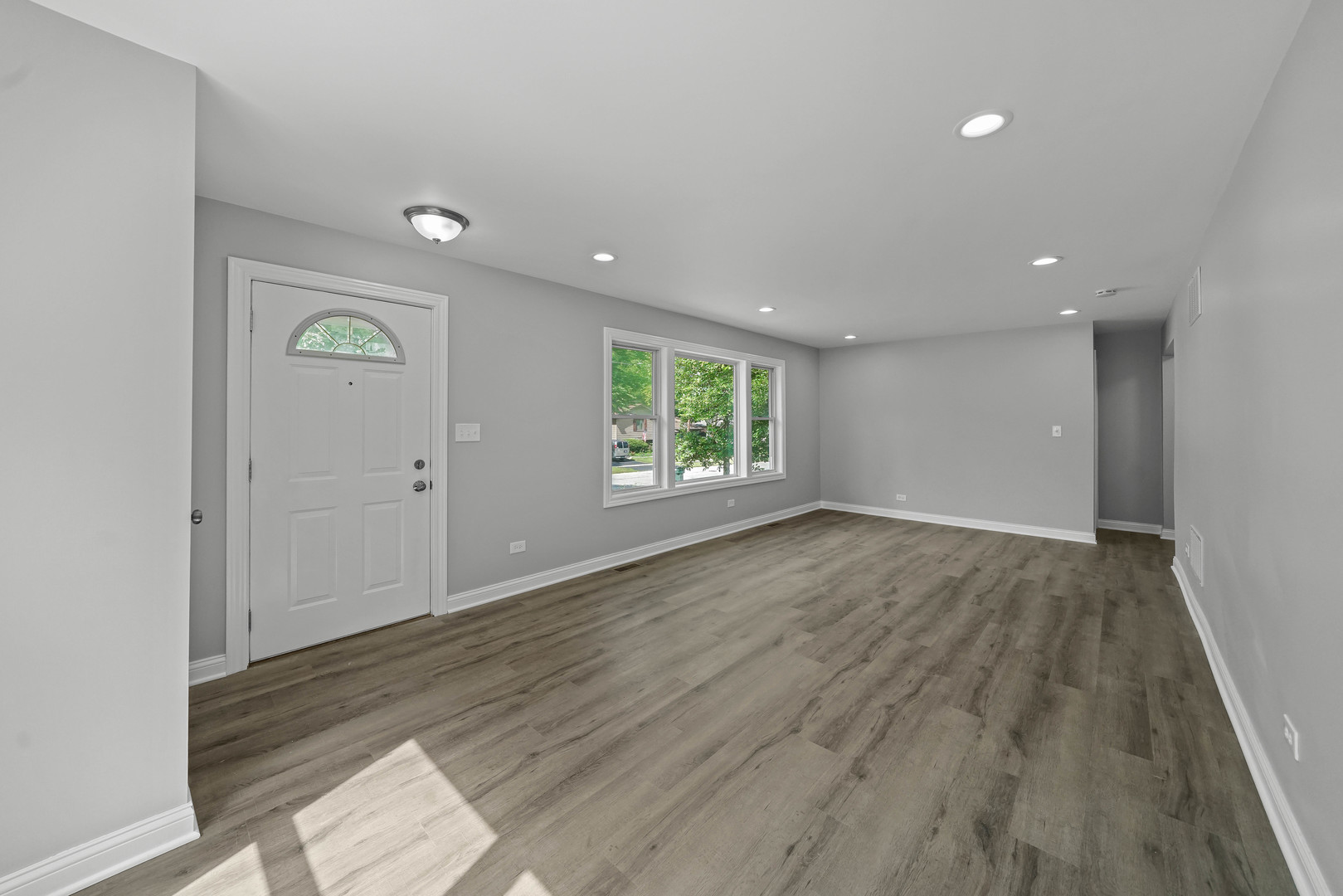 1441 Burr Oak Road Homewood, IL 60430 - Photo 5 of 27 an empty room with wooden floor and windows