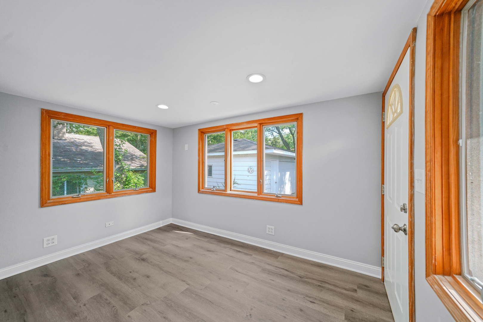 1441 Burr Oak Road Homewood, IL 60430 - Photo 10 of 27 an empty room with wooden floor and windows