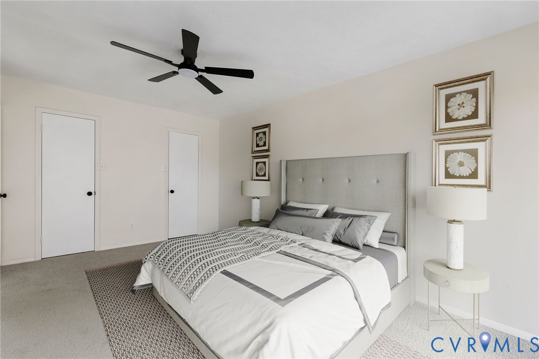 1501 Largo Road, Unit 301 Henrico, VA 23238 - Photo 24 of 40 a bedroom with a bed and painting on the wall