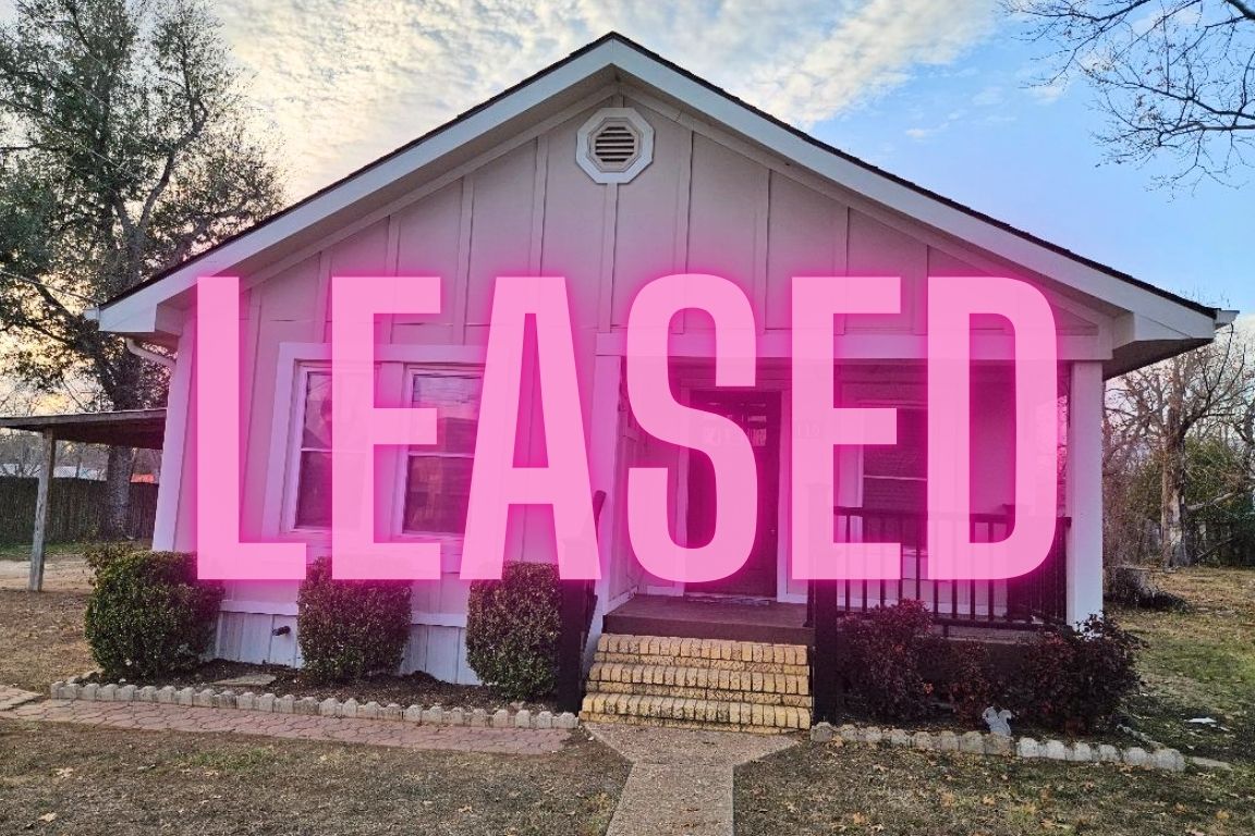 110 Lexington Road Elgin, TX 78621 - Photo 1 of 1 a sign on the side of a building