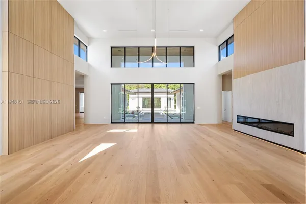 a large kitchen with kitchen island a sink stainless steel appliances and cabinets