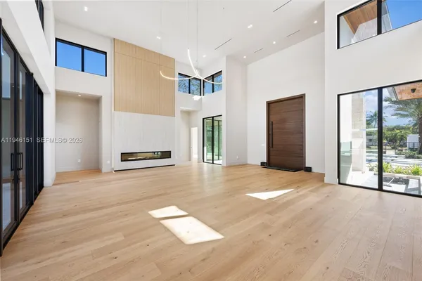 a kitchen with a stove a counter space a sink and cabinets