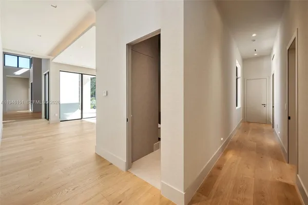 a hallway with white doors