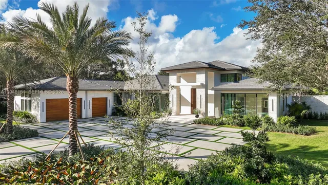 a front view of a house with garden