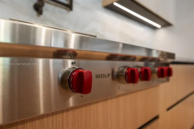 a view of a house with pool and chairs