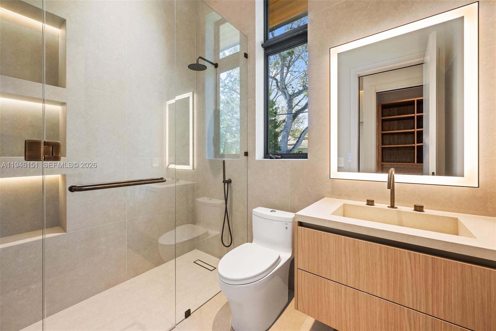 7725 Southwest 114th Street Pinecrest, FL 33156 - Photo 63 of 94 a bathroom with a sink a toilet and shower