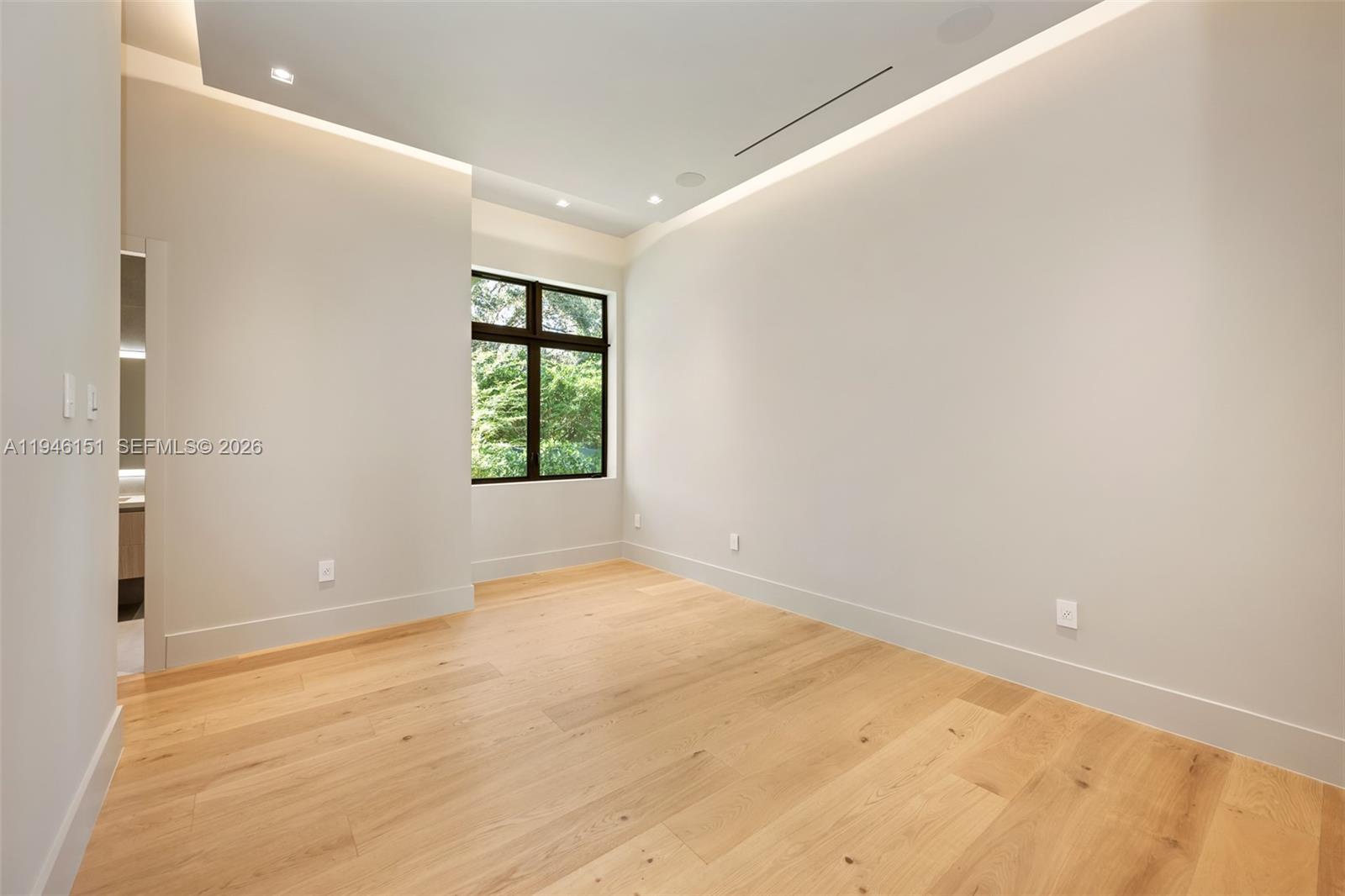 7725 Southwest 114th Street Pinecrest, FL 33156 - Photo 64 of 94 an empty room with a window