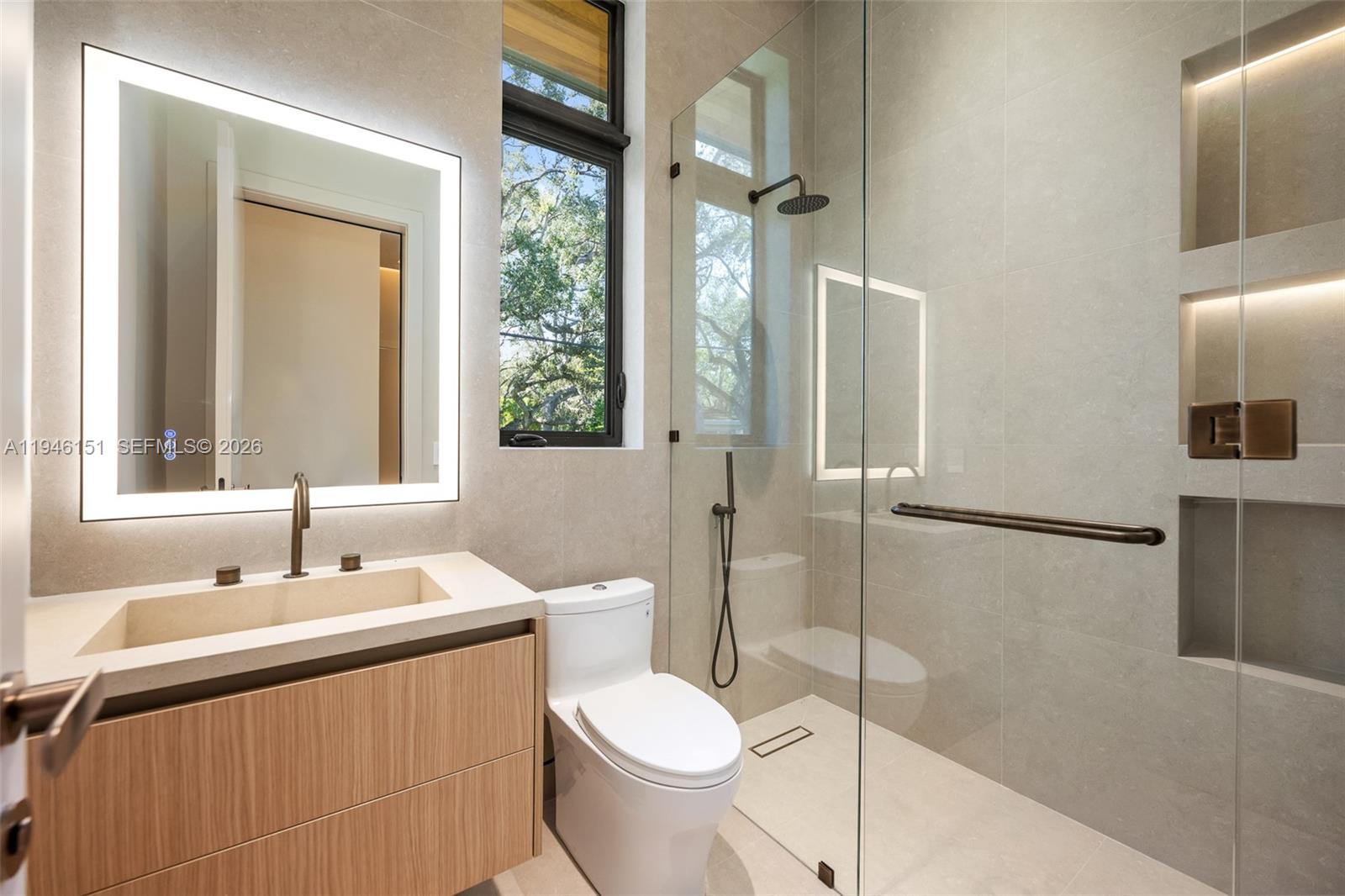 7725 Southwest 114th Street Pinecrest, FL 33156 - Photo 66 of 94 a bathroom with a sink toilet and shower