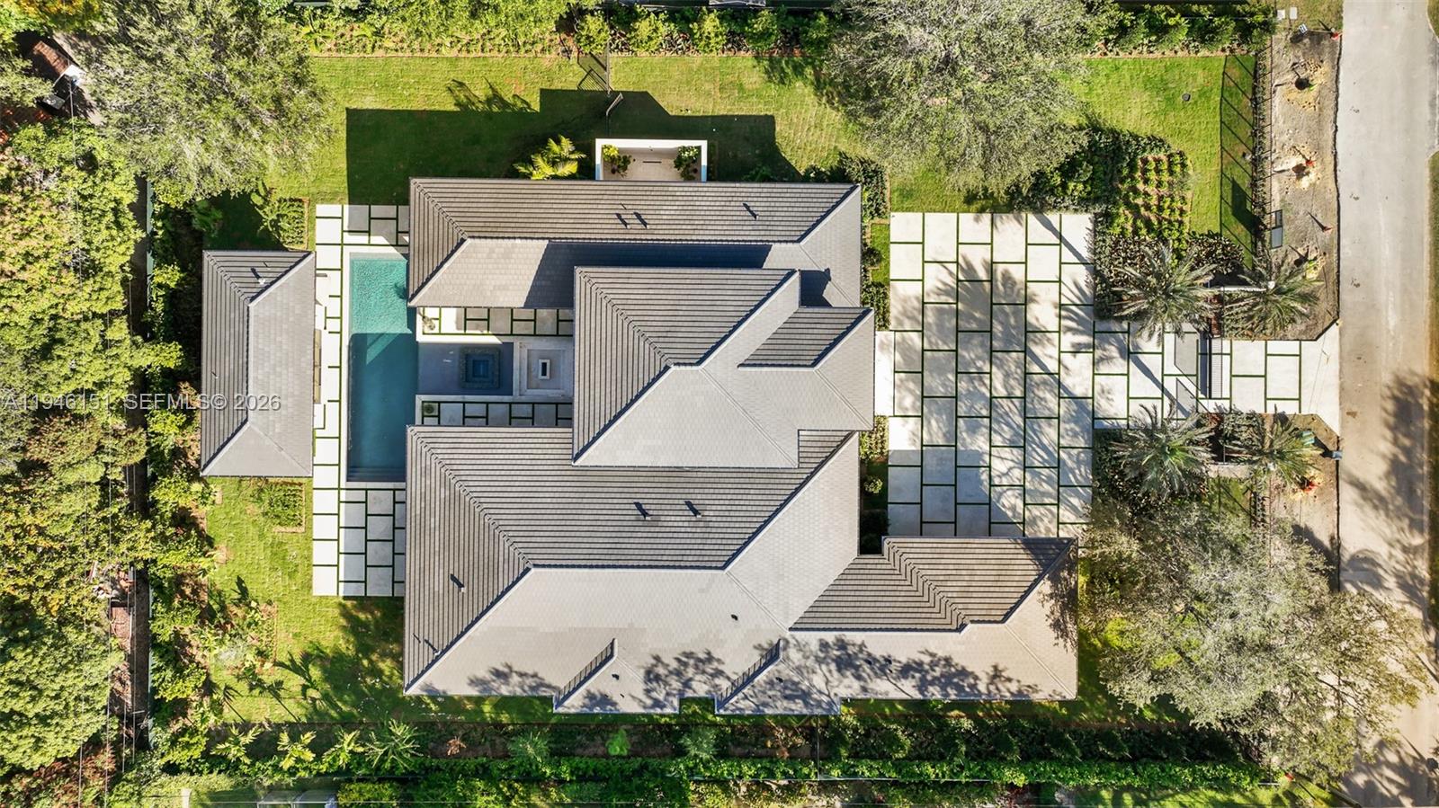 7725 Southwest 114th Street Pinecrest, FL 33156 - Photo 9 of 94 an aerial view of a house with a yard