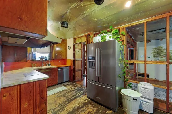 a kitchen with a sink and cabinets