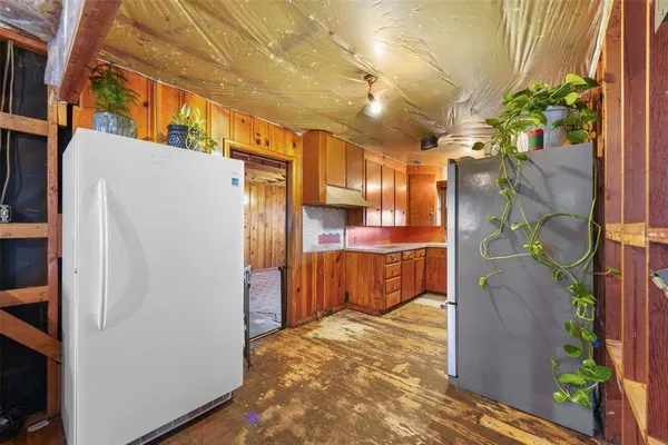 a kitchen with stainless steel appliances granite countertop a sink and cabinets