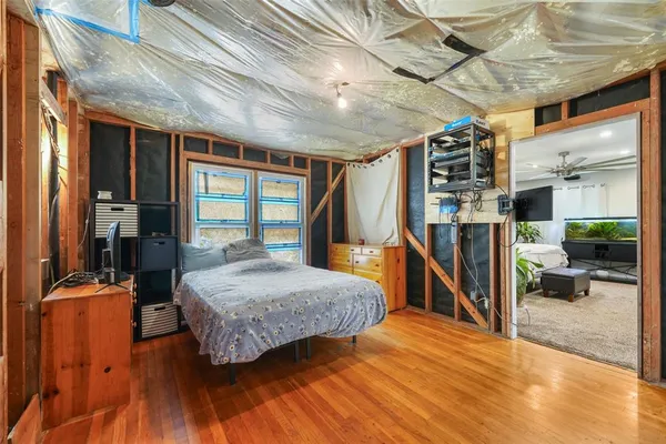a view of an entryway with wooden floor and door