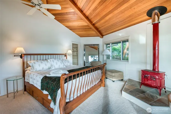 a bedroom with furniture and a window