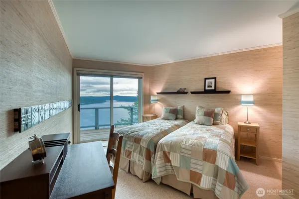 a bedroom with a bed and a night stand