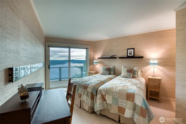 a bedroom with a bed and a night stand