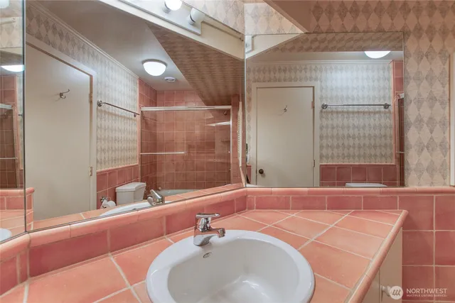 a bathroom with a sink and a mirror