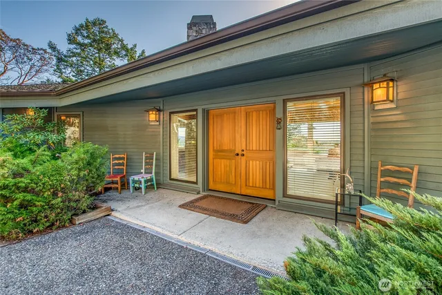 a backyard of a house with outdoor seating