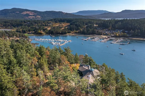 a view of a town with mountains in the background