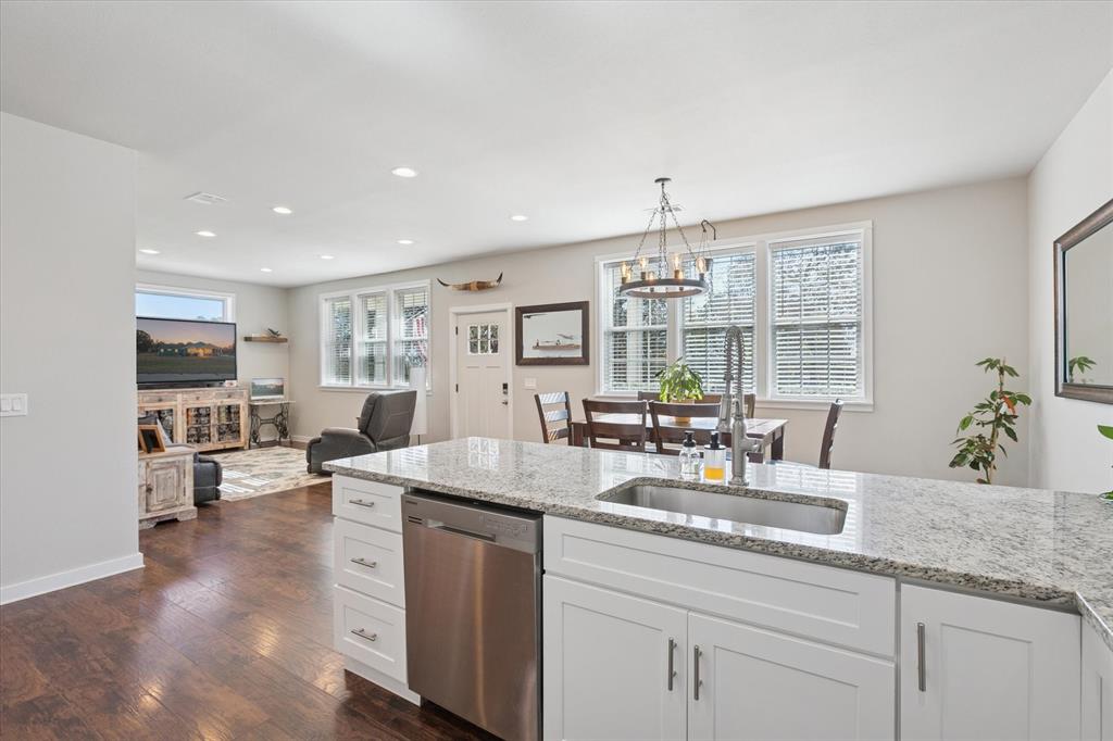 7232 Courtney Drive Azle, TX 76020 - Photo 39 of 39 a kitchen with sink refrigerator and cabinets