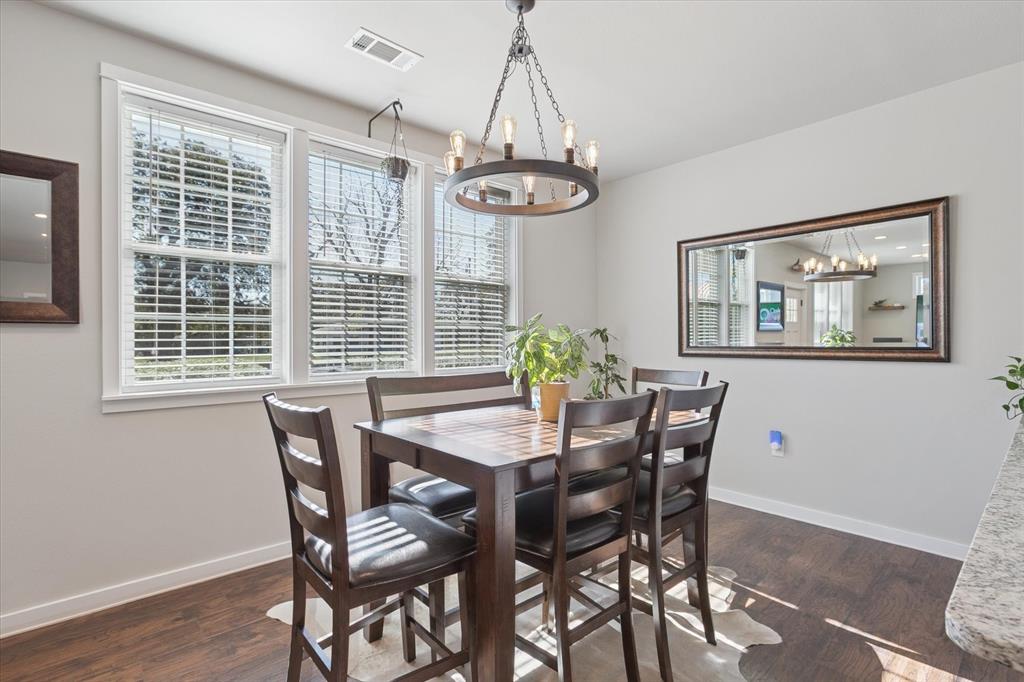 7232 Courtney Drive Azle, TX 76020 - Photo 15 of 39 a view of a dining room with furniture window and wooden floor