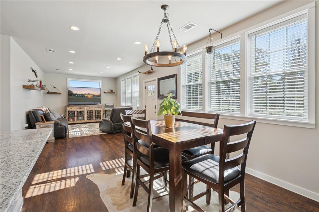 7232 Courtney Drive Azle, TX 76020 - Photo 16 of 39 a view of a dining room with furniture window and wooden floor