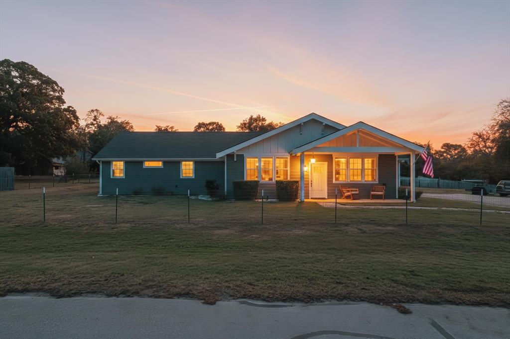 7232 Courtney Drive Azle, TX 76020 - Photo 2 of 39 a front view of a house with a yard