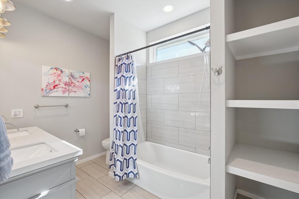 7232 Courtney Drive Azle, TX 76020 - Photo 27 of 39 a bathroom with a bathtub a shower and a toilet