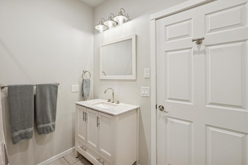 7232 Courtney Drive Azle, TX 76020 - Photo 28 of 39 a bathroom with a sink and mirror